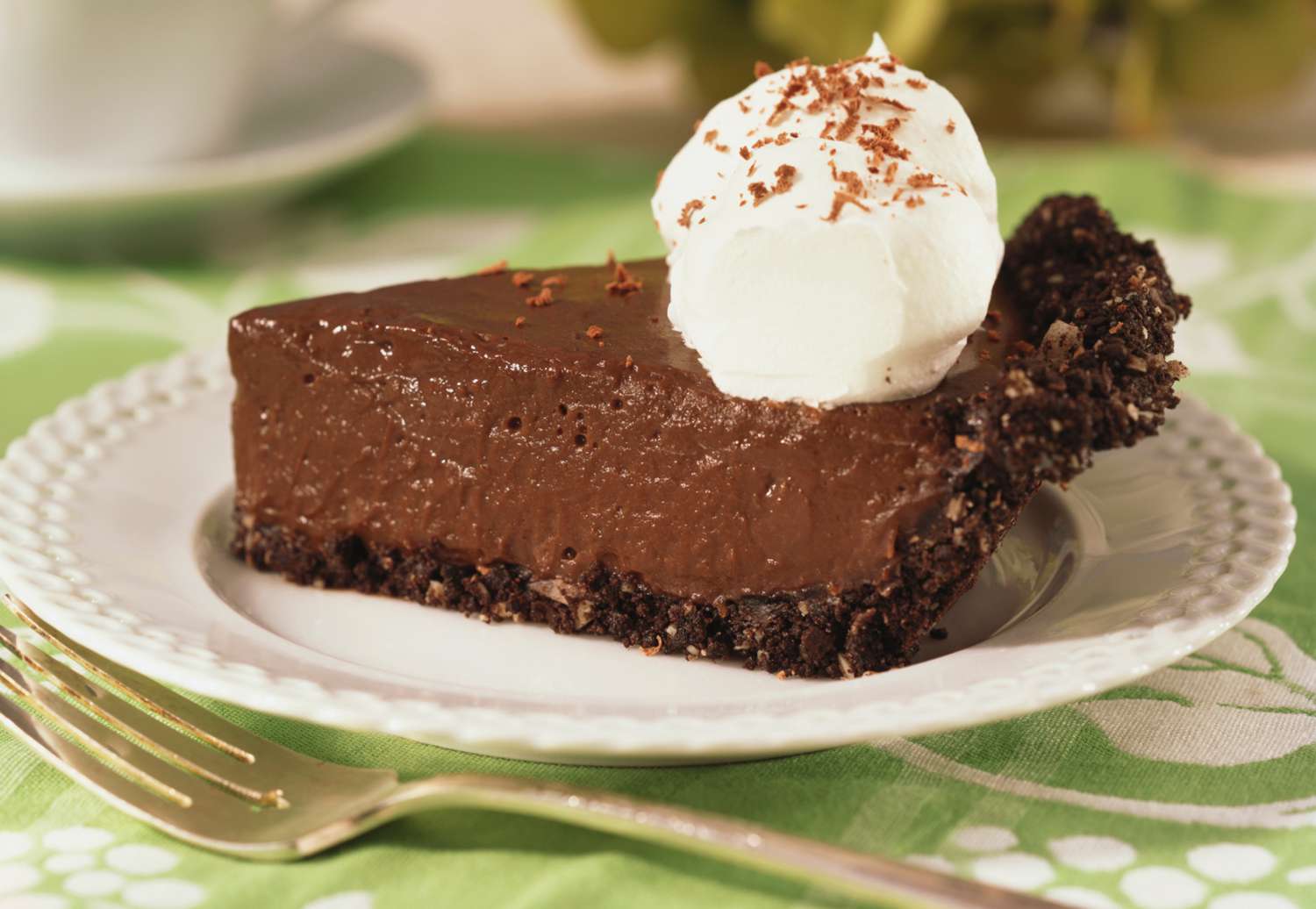 High-quality ingredients for making chocolate cream pie laid out on a kitchen surface